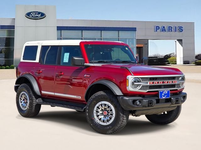 2026 Ford Bronco Outer Banks in Ruby Red Metallic Tinted Clearcoat — front three-quarter view